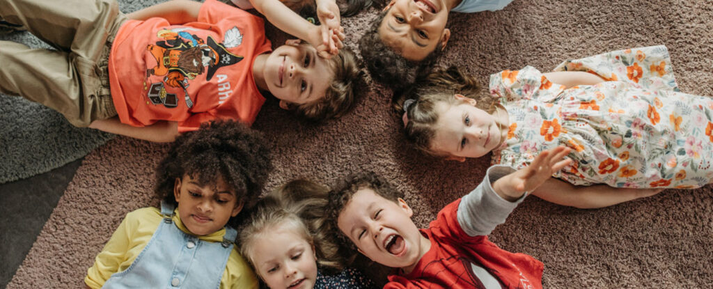 Children laying down in a circle